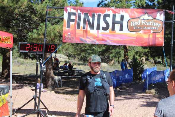 looking pretty wrecked as I cross the finish line with an unofficial clock time of 2:30:19