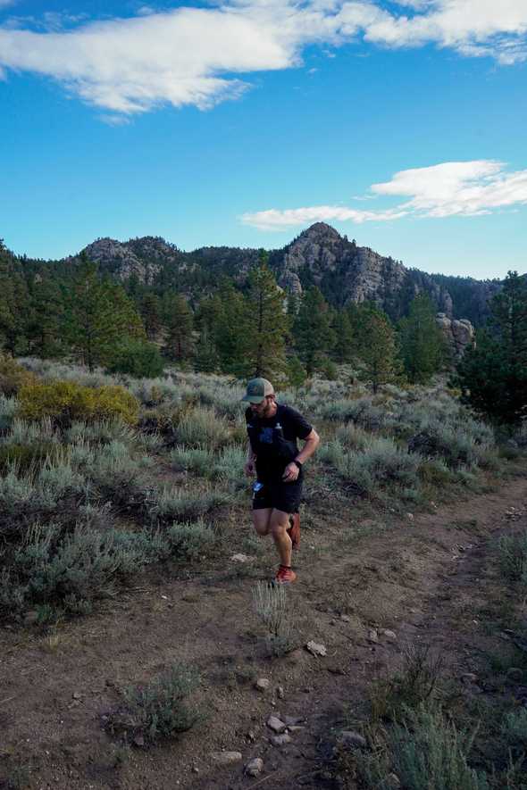 Action shot of me running on course with mountains in the background